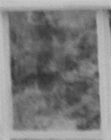 Enlargement: Left Window, Lower Half, Center Pane (Full Spectrum) : The Rebecca Nurse Homestead, Danvers (Salem Village), Massachusetts (2015): Is that one evil-looking face or what? Enlargement: Left Window, Lower Half, Center Pane (Full Spectrum)
